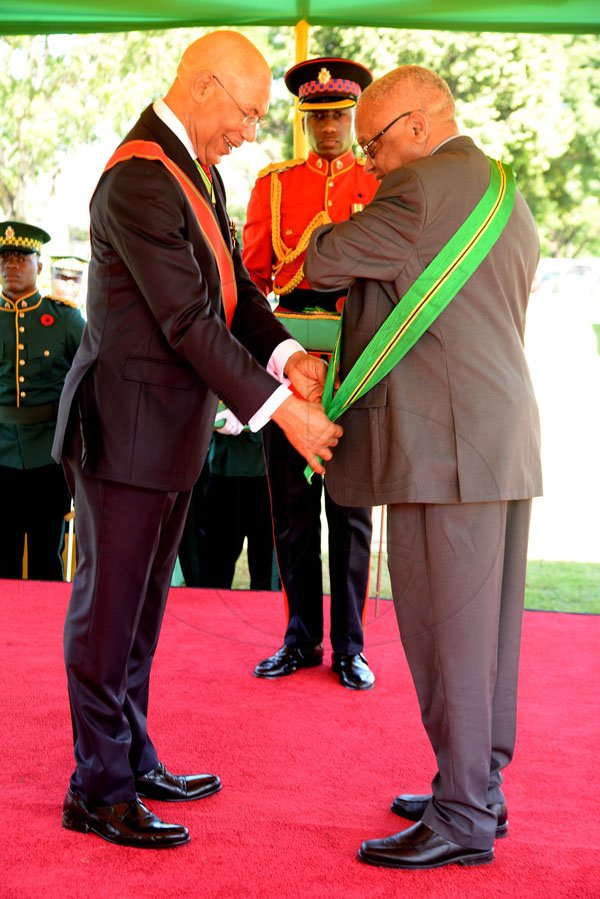 Lionel Rookwood/PhotographerProfessor Archibald Horace McDonald CD recieves The Order Of Jamaica from Governor General Sir Patrick Allen at The National Awards held at King's House on Monday October16,2017.