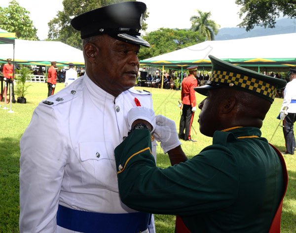 Lionel Rookwood/PhotographerSenior Supt.of Police Arthur Brown recieves The Medal Of Honour For Meritorious Service at The National Honour and Awards Ceremony held at King's House on Monday October16th,2017.