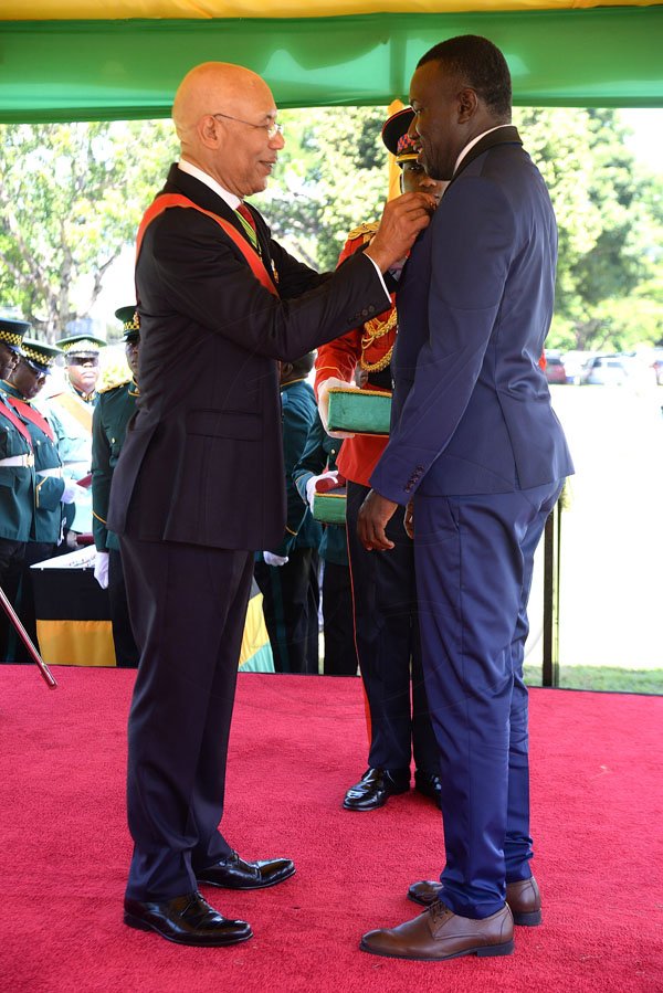 Lionel Rookwood/PhotographerTheodore Eccleston "Tappa" Whitmore recieves The Order Of Distinction in the rank of Commander for contribution to  Sports,Nationally and Internationally,in partically Football as a player and coach from Governor General Sir Patrick Allen at The National Honours and Awards Ceremony held at King's House on Monday October16th,2017.