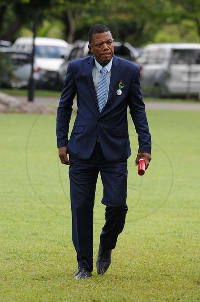 Lionel Rookwood/PhotographerDonovan Dacres walks back after being presented the Badge of Honour for Meritorious Service at the Presentation of National Honours and Awards held at King's House on October 15th,2018.