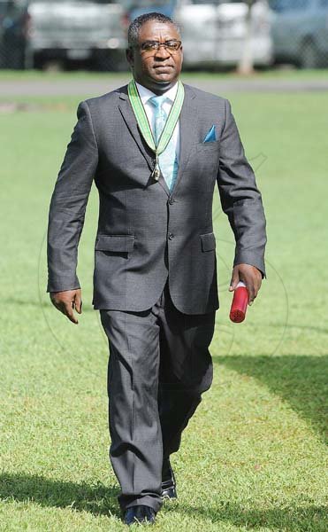 Lionel Rookwood/PhotographerSenator Kavan Gayle OD walks back after being awarded the Order of Distinction in the rank of commander at the Presentation of National Honours and Awards held at King's House on October 15th,2018.