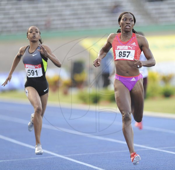 Ricardo Makyn/Staff Photographer
Novelette Williams-Mills runs to win the women's 400 metres final at the JAAA/Supreme Ventures National Senior Track and Field Athletics Championships at the National Stadium on Sunday night.