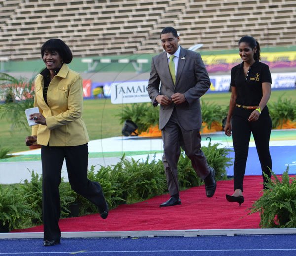 Ricardo Makyn/Staff Photographer
Prime Minister the Most Honourable Portia Simpson Miller with Opposition Leader the Hon Andre Holness and The Hon Lisa Hanna Minister of Youth and Culture at the openning ceremony for the Supreme Ventures JAAA National Senior Championship at the National Stadium  on Friday 29.6.2012