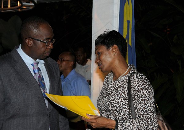 Winston Sill/Freelance Photographer
National Commercial Bank (NCB) Auto Dealers Awards Cocktails and Presentation, held at Hope Botanical Gardens, Old Hope Road on Tuesday night July 9, 2013. Here are Patrick Hylton (left), Group Managing Director, NCB; and Audret Tugwell-Henry (right), Senior General Manager, Retail Banking Division,NCB.