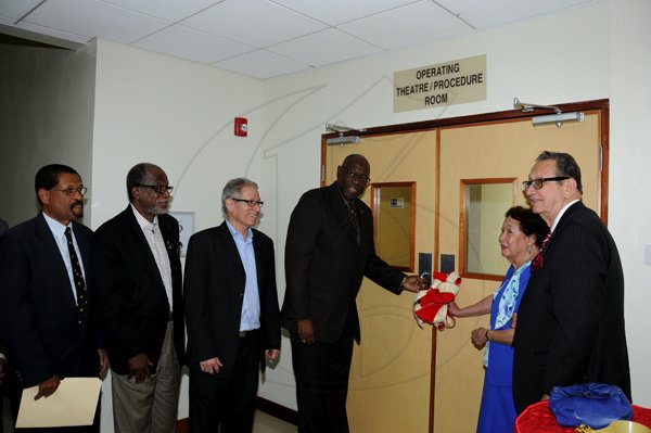 Winston Sill / Freelance Photographer
The University Hospital of the West Indies Private Wing Limited (UHWI-PWL) official opening of the new Wing and Operating Theatre at Tony Thwaites Wing, held at UHWI,Mona on Friday evening November 30, 2012  Here are Dr. Trevor McCartney (left), Acting CEO, UHWI; Ryland Campbell (second left); Mark Thwaites (third left), Chairman, UHWI-PWL; Dr. Fenton Ferguson (centre), Minister of Health; Patsy Thwaites (second right), (Tony Thwaites widow); and Danny Williams (right), Director, UHWI-PWL.