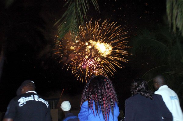 Ricardo Makyn/Staff Photographer.
Hundreds of Jamaicans flocked to the waterfront, downtown Kingston on Friday night to welcome the new year. here, some state at the fireworks which were on display at midnight.