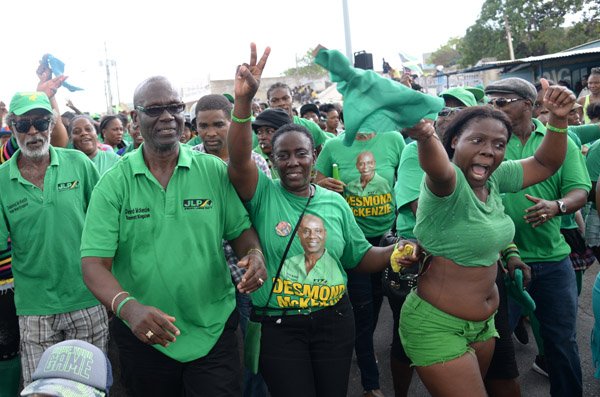 Jermaine Barnaby/Photographer
Desmond Mckenzie with some supporters on Spanish Town road on Tuesdayy February 9, 2016.