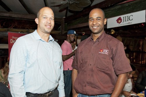 Contributed

Pete Walker (right), risk and reinsurance manager, JIIC poses with Rory Marsh, real estate associate, Meldam Realtors were spotted at the Ochi Corporate mingle in Sta Ann recently.

******************************************************************************** held at Magaritaville on Saturday December 8,2011.