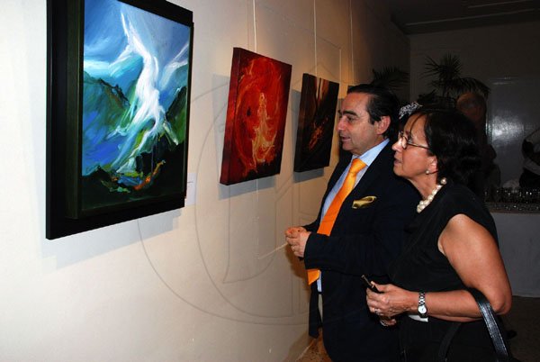 Colin Hamilton/Freelance Photographer
Chilean Ambassador Alfredo Garcia and his wife Luc Garcia view Waldemar paintings at Patrick Waldemar's Explorations on Canvas at the Olympia Gallery.