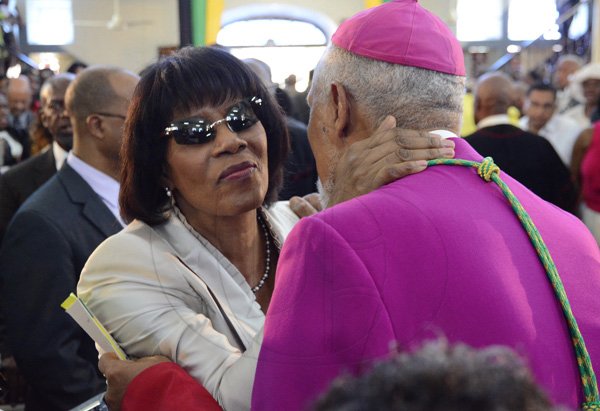 Rudolph Brown/Photographer
Prime Minister Portia Simpson Miller greets Rev. Donald Reece, President of the Jamaica Council of Churches at the service of thanksgiving for the 140th Anniversary of the City of Kingston and The Achievements of the London 2012 Olympians and Paralympians " Repairing the Breach, Restoring the Treasure" at the East Queen Street Baptist Church on East Queen Street in Kingston on Sunday, October 14, 2012