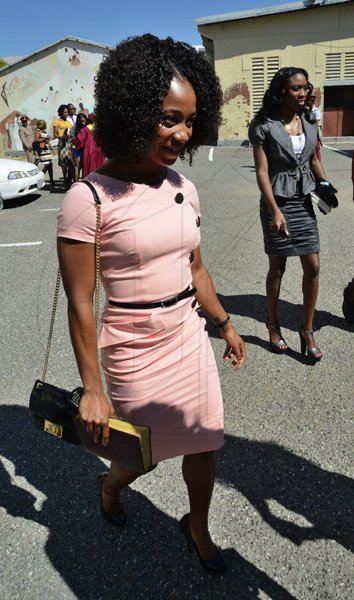 Rudolph Brown/Photographer
Olympian Shelly-Ann Fraser Pryce, (left) and Sherika Williams arrive at the service of thanksgiving for the 140th Anniversary of the City of Kingston and The Achievements of the London 2012 Olympians and Paralympians " Repairing the Breach, Restoring the Treasure" at the East Queen Street Baptist Church on East Queen Street in Kingston on Sunday, October 14, 2012
