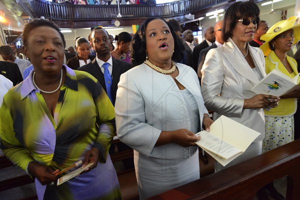 Rudolph Brown/Photographer
From left Olivia Grange, Natalie Neita Headley, Prime Minister Portia Simpson Miller and Sonia Fuller at the Service of thanksgiving for the 140th Anniversary of the City of Kingston and The Achievements of the London 2012 Olympians and Paralympians " Repairing the Breach, Restoring the Treasure" at the East Queen Street Baptist Church on East Queen Street in Kingston on Sunday, October 14, 2012