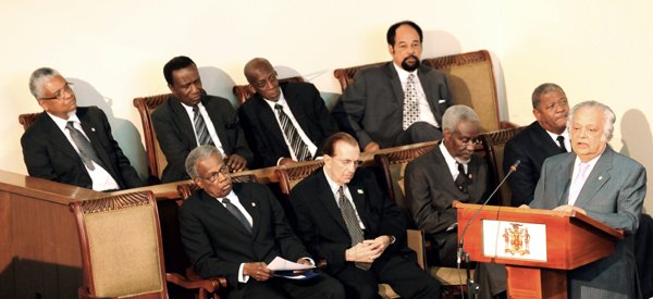 Ricardo Makyn/Staff Photographer.
Former chancellor of the University of the West Indies Sir Shridath Ramphal speaks from the lecturn during yesterday's special parliamentary sitting in honour of the late Professor Rex Nettleford. Seated in the well are (from left, back row) Professor E. Nigel Harris, vice chancellor of the University of the West Indies (UWI); Edwin Carrington, Secretary General of CARICOM; Burchell Whiteman, former Jamaica High Commissioner to the United Kingdom; Senator Oswald Harding, president of the Senate. In the front row from left are Sir George Alleyne, chancellor of the UWI; former Jamaican prime ministers Edward Seaga and P.J. Patterson; and Baldwin Spencer, prime minister of Antigua and Barbuda. In the foreground is South St James Member of Parliament Derrick Kellier.