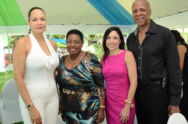 Rudolph Brown/Photographer
Tara Nunes, (second right) vice president, sales and investment services, Sagicor Investment pose with from left Valerie Robinson, Opposition spokesperson on Youth and Culture, Olivia 'Babsy' Grange and Tony Robinson at the PAJ President's brunch at the Pegasus Hotel on Sunday, November 23, 2014
