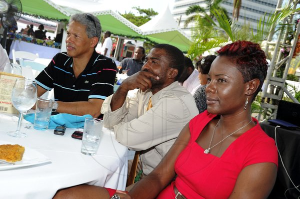 Norman Grindley / Chief Photographer
Donavon Perkins of Sagicor (right) Rohan Powell and Nadine McCleod caught up in the entertainment.

______
PAJ president brunch.