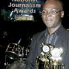 Winston Sill / Freelance Photographer
The Gleaner's staff photographer Ricardo Makyn beams after winning the Junior Dowie award for sports photography and the Ashton Rhoden award for news photography at the Press Association of Jamaica's national journalism awards banquet at the Jamaica Pegasus Hotel, in St Andrew, on Friday.