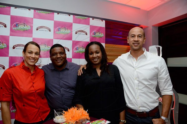 Winston Sill/Freelance Photographer
Pandemonium Welcome Reception for Machel Montano, held at J. wray and Nephew Head Office, Dominica Drive, New Kingston on Tuesday night April 22, 2014. Here are Tamara Harding (left); Colin Smith (second left); Erica Williams (second right); and Zachary? Harding (right).