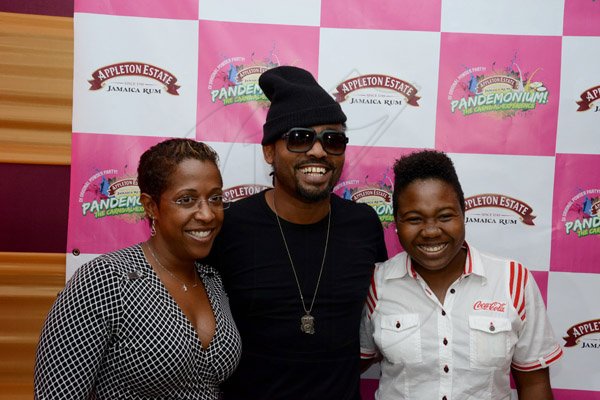 Winston Sill/Freelance Photographer
Pandemonium Welcome Reception for Machel Montano, held at J. wray and Nephew Head Office, Dominica Drive, New Kingston on Tuesday night April 22, 2014. Here are Nyree Coke (left); Machel Montano (centre); and Chloe DaCosta (right), Brand Manager, Coke.