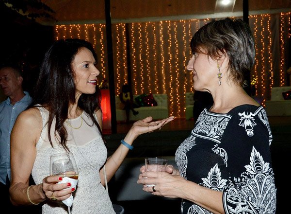 Winston Sill/Freelance Photographer
Heather Facey (left) and Cynthia Hanworth engrossed in their conversation at Pan Jamaica Christmas Party and Staff Awards, held at the Sunken Garden, Hope Gardens.