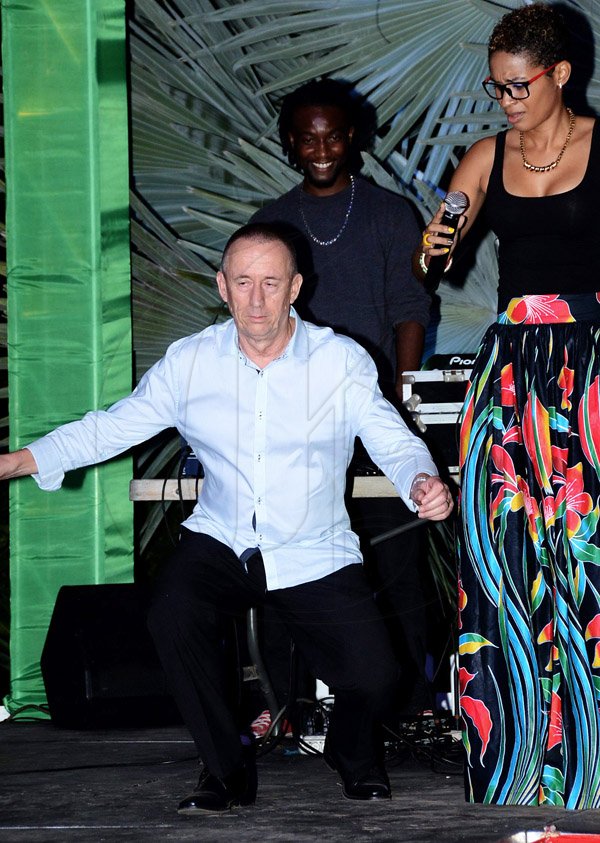 Winston Sill/Freelance Photographer
Pan Jamaica Christmas Party and Staff Awards, held at the Sunken Garden, Hope Gardens, Old Hope Road on Saturday night December 20, 2014.Paul Hanworth does his version of the dance 'gully creeper' while Nadine Tarawali looks on.