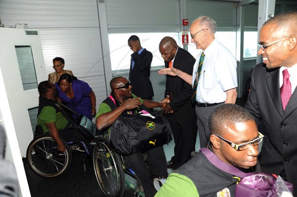 Norman Grindley/Chief Photographer
The Jamaica paralympic Association team arrives at the Norman international airport in Kingston yesterday.