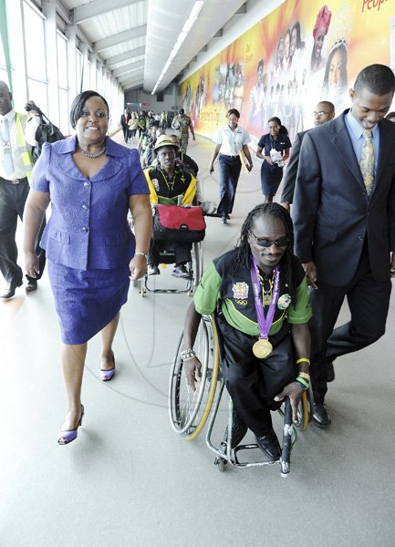 Norman Grindley/Chief Photographer
The Jamaica paralympic Association team arrives at the Norman international airport in Kingston yesterday.