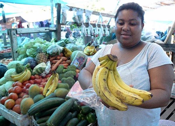 Ian Allen/Staff Photographer
 fruit and Vegetable Vendor in Port Antonio Market.