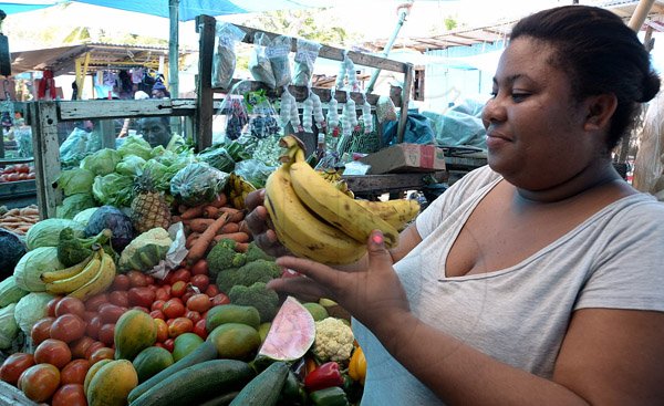 Ian Allen/Staff Photographer
fruit and Vegetable Vendor in Port Antonio Market.