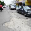 Ricardo Makyn/Staff Photographer 
Bad roads Cumberland Road  in Spanish Town.