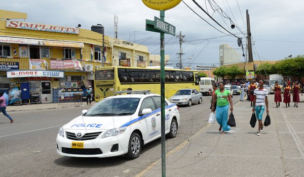 Ricardo Makyn/Staff Photographer 
A Police vehicle on Burke Road in Spanish Town.