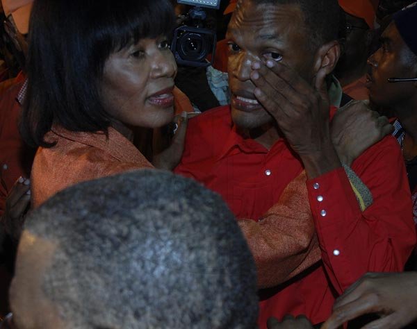 --- business social ---

Ian Allen/Photographer
Face of the week runner up, Damian Crawford is overcome with emotion. Young Crawford makes history as the first dredlocked parliamentarian. He is seen here with PNP party leader Portia Simpson Miller.