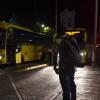 Jeromey Carter awaits a driver for the Jamaica Urban Transit Company bus travelling to his destination in Portmore at approximately 8:10 p.m. at South Parade in Kingston on Wednesday. A seven-night islandwide curfew commenced at 8 p.m. April 1, 2020.
