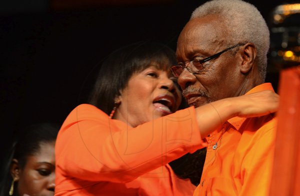 Rudolph Brown/Photographer
Former Prime Minister P. J. Patterson greets Pime Minister Portia Simpson Miller at the PNP's 74th Annual Conference 2012 at National Arena in Kingston on Sunday, September 16-2012