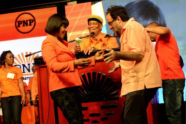 Rudolph Brown/Photographer
Mark Golding, Minister of Justice dance with Prime Minister Portia Simpson Miller at the PNP's 74th Annual Conference 2012 at National Arena in Kingston on Sunday, September 16-2012