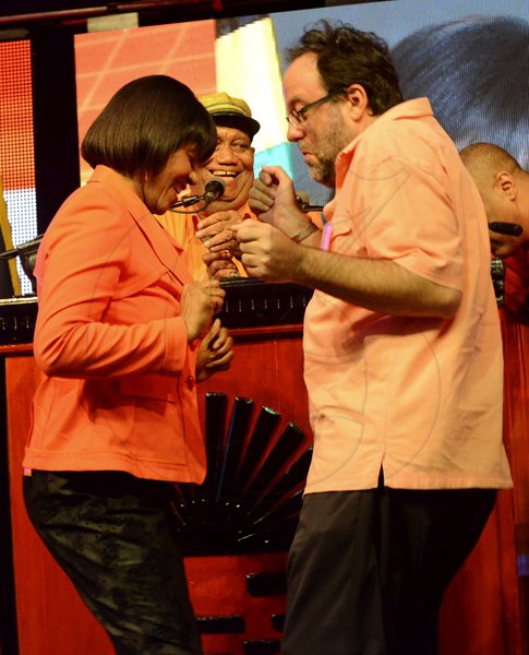 Rudolph Brown/Photographer
Mark Golding, Minister of Justice dance with Prime Minister Portia Simpson Miller at the PNP's 74th Annual Conference 2012 at National Arena in Kingston on Sunday, September 16-2012