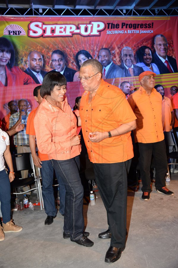 Jermaine Barnaby/Photographer
Prime Minister Portia Simpson Miller and Peter Phillips dancing together at the PNP rally in Black River, St. Elizabeth on Sunday November 22, 2015.