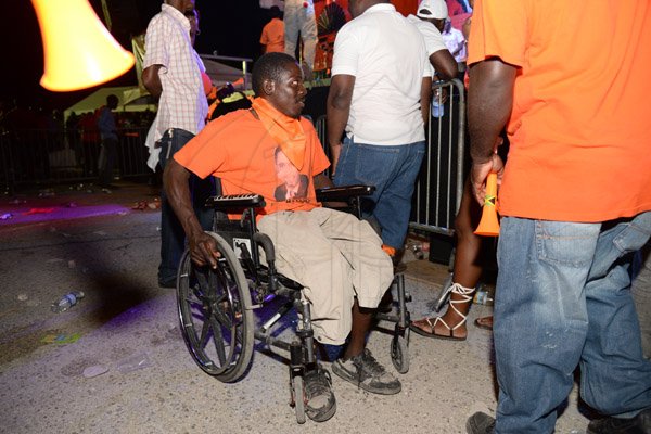 Jermaine Barnaby/Photographer
A wheelchair bound man at the PNP rally in Black River, St. Elizabeth on Sunday November 22, 2015.