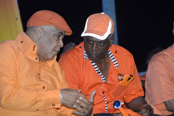 Jermaine Barnaby/Photographer
Robert Pickersgill (left) talks at the PNP rally in Black River, St. Elizabeth on Sunday November 22, 2015.