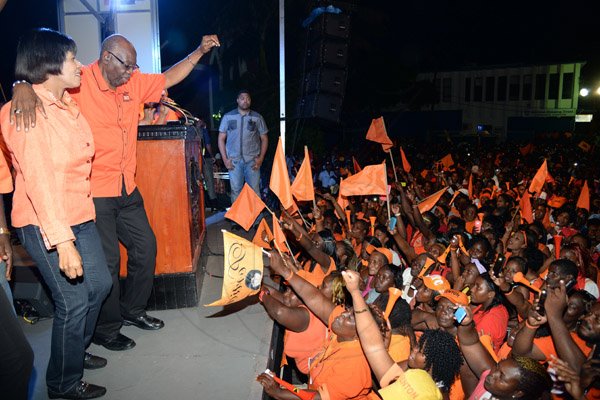 Jermaine Barnaby/Photographer
Portia Simpson Miller (left) and Fenton ferguson dancing up a storm at the PNP rally in St Thomas on Sunday November 29, 2015.