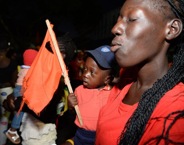 Jermaine Barnaby/Photographer
A woman and her baby at the PNP rally in St Thomas on Sunday November 29, 2015.