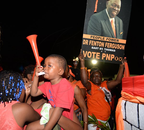 Jermaine Barnaby/Photographer
A woman and her baby at the PNP rally in St Thomas on Sunday November 29, 2015.