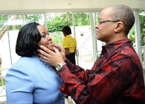 Rudolph Brown/Photographer
Dr Michael Abrahams  was caught delicately fixing the lips of Minister  Natalie Neita-Headley before the start of the Pocket Rocket Foundation scholarship presentation ceremony at Devon House on Tuesday