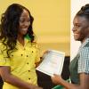 Rudolph Brown/Photographer
Double Olympic Sprint Champion Shelly-Ann Fraser Pryce, Chairperson of the Pocket Rocket Foundation presents scholarship to Kimone Shaw of St Jago High at the Pocket Rocket Foundation scholarship to them at the presentation ceremony at Devon House on Tuesday, September 17, 2013