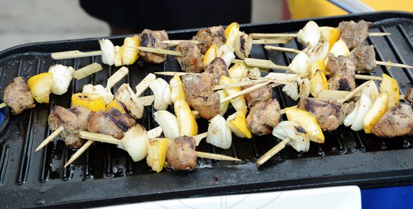Rudolph Brown/Photographer
Jerk Kebabs 


......................................................................with vegetables at the Best Dressed Chicken Portland Jerk Festival at Folly Ruins in Portland on Sunday, July 7, 2013