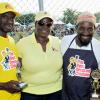 Rudolph Brown/Photographer
Heather Collins, (right) Sales Manager of Best Dressed and Cordia Panton-Williams, pose with winners Malik Martin, (second right) 1st place winner of Royal Maroon and 2nd runner up David Graham pose with winning trophy at the Best Dressed Chicken Portland Jerk Festival at Folly Ruins in Portland on Sunday, July 7, 2013