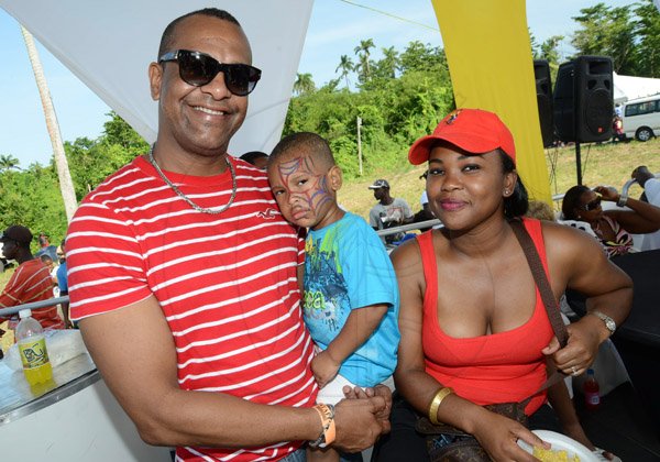 Rudolph Brown/Photographer
From left Michael, Chad and Khadene McKenzie at the Best Dressed Chicken Portland Jerk Festival at Folly Ruins in Portland on Sunday, July 7, 2013