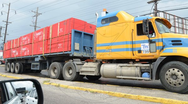Rudolph Brown/PhotographerThis trailer load of ply board arrives at the Super Valu Home Centre in Liguanea in preparation for Hurricane Matthew on Saturday, October 1, 2016