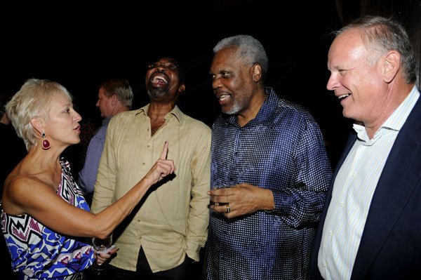 Winston Sill / Freelance Photographer
The Portia Simpson-Miller Foundation annual Scholarship Award Fundraising Party, held at Norbrook Drive, on Friday night November 16, 2012. Here are Kelly Tomblin (left); Lloyd Tomlinson (second left); Errald Miller (second right); and Steve Morgan (right).
