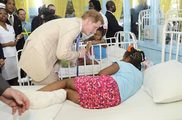 Rudolph Brown/Photographer
Prince Harry chat with children during a visit the Bustamante Hospital for Children on Tuesday, March 6-2012