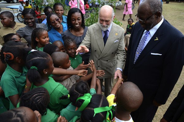 Ricardo Makyn/Staff Photographer 
Centre His Royal Highness  Michael of Kent greets Students of the Hope Valley Experimental School with Hon.Dr.Fenton Ferguson Minister of Health while the Prince was on a tour of the Sir John Golding rehabilitation Centre in Mona on His Royal Visit on Tuesday 16.4.2013